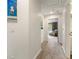 Hallway featuring neutral walls, carpeted floor, and an open doorway that leads into a comfortably styled room at 2238 Parkview Nw Ct, Atlanta, GA 30318
