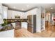 Modern kitchen with stainless steel appliances, granite countertops, and white cabinets at 2238 Parkview Nw Ct, Atlanta, GA 30318