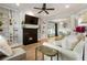 Bright living room featuring a fireplace, built-in bookshelves, and hardwood flooring at 2238 Parkview Nw Ct, Atlanta, GA 30318