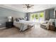 Spacious main bedroom with large window, seating area, tray ceiling and neutral decor at 2238 Parkview Nw Ct, Atlanta, GA 30318
