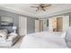 Comfortable main bedroom with ceiling fan, and a glimpse into the ensuite bathroom at 2238 Parkview Nw Ct, Atlanta, GA 30318