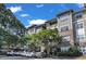 Attractive multi-level condo building with beige siding and manicured landscaping at 2700 Pine Tree Ne Rd # 1015, Atlanta, GA 30324