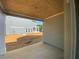 Covered porch with wood ceiling showing view of backyard and neighboring house at 4556 Sweetlake Sw Ct, Mableton, GA 30126