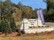 Sweetlake Grove community entrance with attractive signage and landscaping, surrounded by mature trees, welcoming residents at 4556 Sweetlake Sw Ct, Mableton, GA 30126