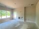 Large living room with a fireplace and door leading to the back patio at 4556 Sweetlake Sw Ct, Mableton, GA 30126