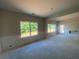 Spacious living room with two large windows and wainscotting, ready for personalization at 4556 Sweetlake Sw Ct, Mableton, GA 30126