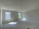 Spacious living room with two large windows letting in natural light and providing great views at 4556 Sweetlake Sw Ct, Mableton, GA 30126