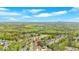 Breathtaking aerial view of a home nestled in a lush, green neighborhood near a scenic lake and rolling hills at 17 Brightwater Cv, Dallas, GA 30157