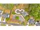 Aerial shot of the property highlighting a swimming pool, driveway, and surrounding greenery at 17 Brightwater Cv, Dallas, GA 30157