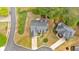 Aerial view of a home with a long driveway, mature trees, and well-kept landscaping at 17 Brightwater Cv, Dallas, GA 30157