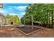 Backyard featuring a swing set and picnic table on a mulched play area at 17 Brightwater Cv, Dallas, GA 30157