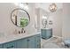 Dual sink vanity with marble countertop in a light and airy bathroom provides ample space at 17 Brightwater Cv, Dallas, GA 30157