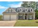 Charming two-story home with a well-manicured lawn, two car garage and inviting front porch at 17 Brightwater Cv, Dallas, GA 30157