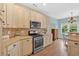Well-equipped kitchen with modern stainless steel appliances and ample counter space at 17 Brightwater Cv, Dallas, GA 30157