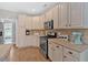 Well-equipped kitchen with modern stainless steel appliances and ample counter space at 17 Brightwater Cv, Dallas, GA 30157