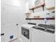 Laundry room features include sleek, modern appliances, extra storage and convenient door for your pet at 17 Brightwater Cv, Dallas, GA 30157