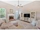 Bright living room featuring a fireplace, hardwood floors, and a cozy atmosphere at 17 Brightwater Cv, Dallas, GA 30157