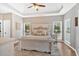 Spacious main bedroom features tray ceiling, neutral colors, plush carpet and bright windows with blinds at 17 Brightwater Cv, Dallas, GA 30157
