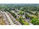 This aerial shot showcases a serene neighborhood nestled by a tranquil lake and mature trees at 4531 Claiborne Ct, Duluth, GA 30096