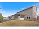 Back exterior of house features a partially fenced yard with screened-in back porch at 4531 Claiborne Ct, Duluth, GA 30096
