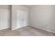 Neutral bedroom with carpet floors, closet, and white doors at 4531 Claiborne Ct, Duluth, GA 30096