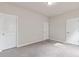 Bedroom with neutral paint colors, carpet, and two closets with a light fixture at 4531 Claiborne Ct, Duluth, GA 30096
