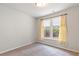 Bright bedroom with carpet floors, large windows, and neutral walls at 4531 Claiborne Ct, Duluth, GA 30096