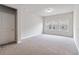 Neutral bonus room with carpet floors and ample natural light from three large windows at 4531 Claiborne Ct, Duluth, GA 30096