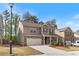 Two-story home with brick and siding, a two-car garage, landscaped yard, and inviting curb appeal at 4531 Claiborne Ct, Duluth, GA 30096