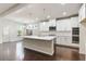 Modern kitchen featuring white cabinets, stainless steel appliances, and a large island at 4531 Claiborne Ct, Duluth, GA 30096
