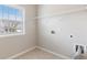 Well-lit laundry room features a window with neighborhood views and hookups ready for appliances at 4531 Claiborne Ct, Duluth, GA 30096