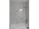 Modern bathroom with a large tub and decorative marbled tile surround at 6881 Homestead Rd, Rex, GA 30273