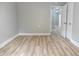 Bedroom featuring hardwood floors and a double-door closet at 6881 Homestead Rd, Rex, GA 30273