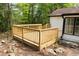Newly constructed wood deck is perfect for entertaining or relaxing outdoors at 6881 Homestead Rd, Rex, GA 30273