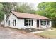 Charming one-story home with a brick chimney and freshly landscaped front yard at 6881 Homestead Rd, Rex, GA 30273