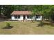 Charming, freshly renovated one-story home with a well-manicured lawn and lovely curb appeal at 6881 Homestead Rd, Rex, GA 30273