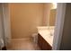 Neutral bathroom featuring a vanity with a white sink and tile flooring at 115 Catlyn Ct, Riverdale, GA 30296
