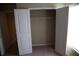 Bedroom closet featuring double doors, carpet flooring and a top mounted clothes rack at 115 Catlyn Ct, Riverdale, GA 30296