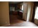View of the kitchen area featuring hardwood floors and stainless steel sink at 115 Catlyn Ct, Riverdale, GA 30296