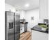 Modern kitchen boasts stainless steel appliances, granite countertops, and stylish hardware at 197 Holcomb Ferry Rd, Roswell, GA 30076