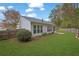 Large backyard with healthy lawn, privacy fence, and mature trees at 3401 Ravensworth Trce, Kennesaw, GA 30144