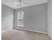Neutral bedroom is illuminated with natural light from the window at 3401 Ravensworth Trce, Kennesaw, GA 30144