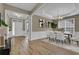 Elegant dining area boasts hardwood floors, decorative molding, and a modern chandelier at 3401 Ravensworth Trce, Kennesaw, GA 30144