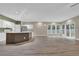 Bright, open-plan living area with hardwood floors and large windows providing natural light at 3401 Ravensworth Trce, Kennesaw, GA 30144