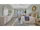 Main bedroom features tray ceilings, large windows, and neutral tones for a relaxing space at 3401 Ravensworth Trce, Kennesaw, GA 30144