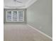 Neutral main bedroom features tray ceilings, plush carpeting, and natural light at 3401 Ravensworth Trce, Kennesaw, GA 30144