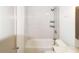 Bathroom featuring tiled shower and tub combination, and modern fixtures at 5024 Park Ave, Forest Park, GA 30297