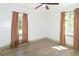 This bedroom has lots of natural light with two large windows and wood-look floors at 5024 Park Ave, Forest Park, GA 30297