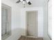 A hallway featuring updated wood-look floors and modern neutral colors at 5024 Park Ave, Forest Park, GA 30297