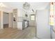 Bright kitchen features white cabinets, modern appliances, and beautiful countertops at 5024 Park Ave, Forest Park, GA 30297